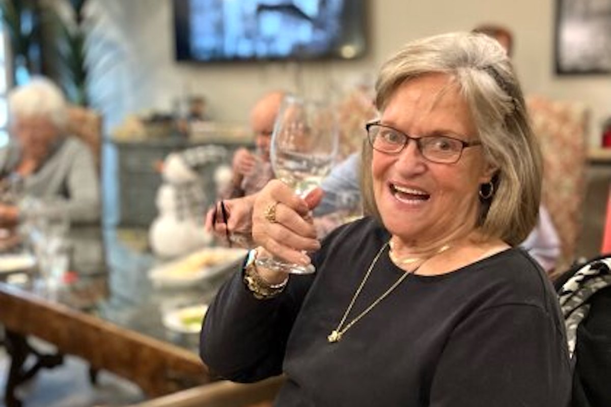 The Bluffs of Flagstaff | Senior drinking wine with her friends