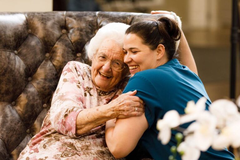 Civitas Senior Living | Resident and caregiver embracing