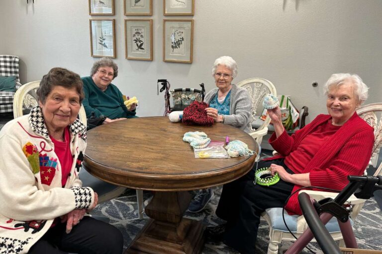 The Hamptons | Residents knitting hats for NICU babies