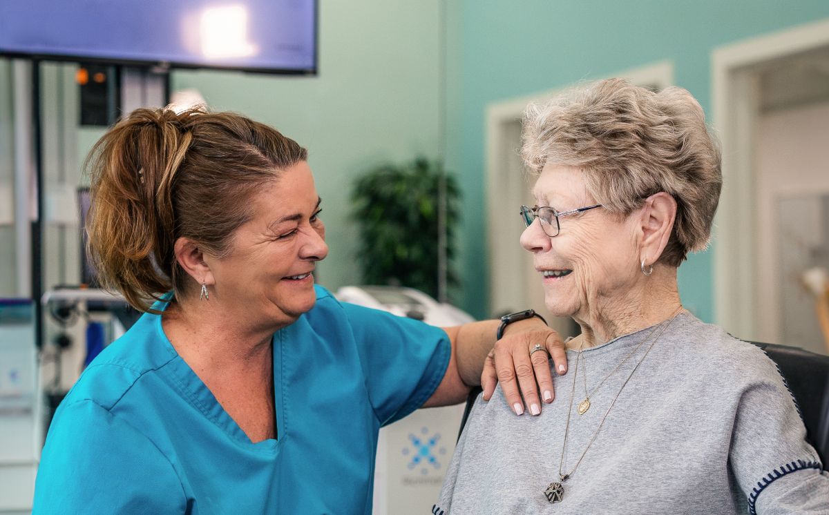 Civitas Senior Living | Caregiver checking on resident