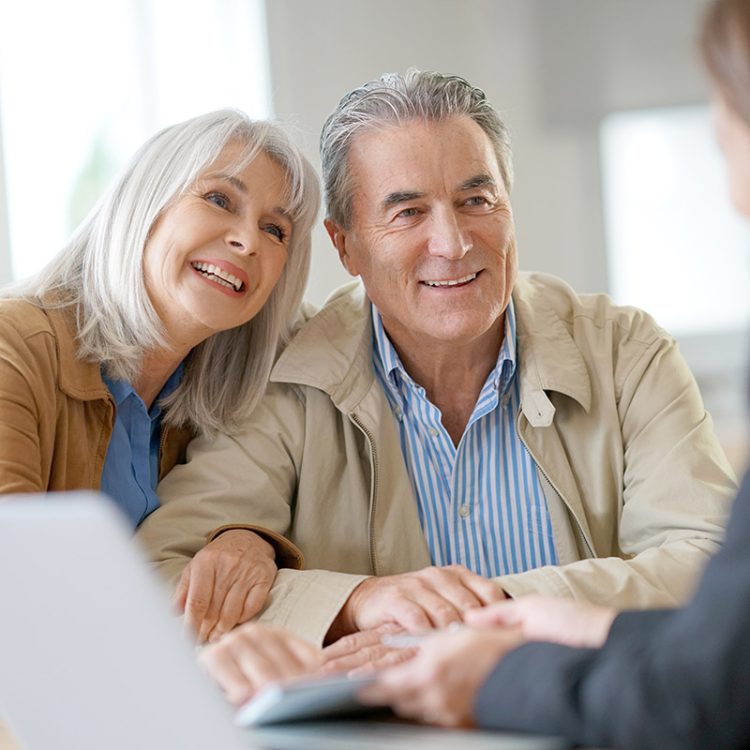 Civitas Senior Living | Senior couple meeting financial adviser for investment