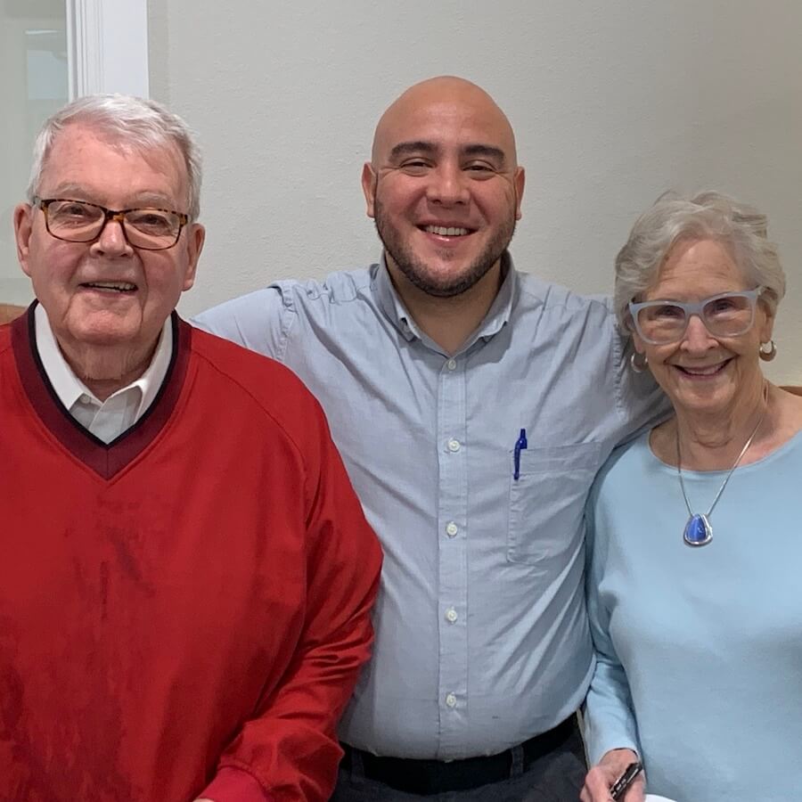 Group of seniors with caregiver