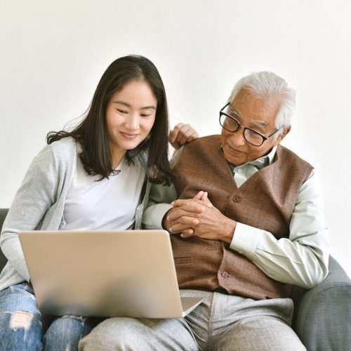 Civitas Senior Living | Senior and granddaughter looking at a laptop