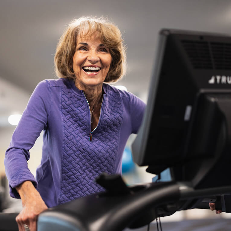 Legacy Oaks of Midlothian | Senior woman exercising on elliptical