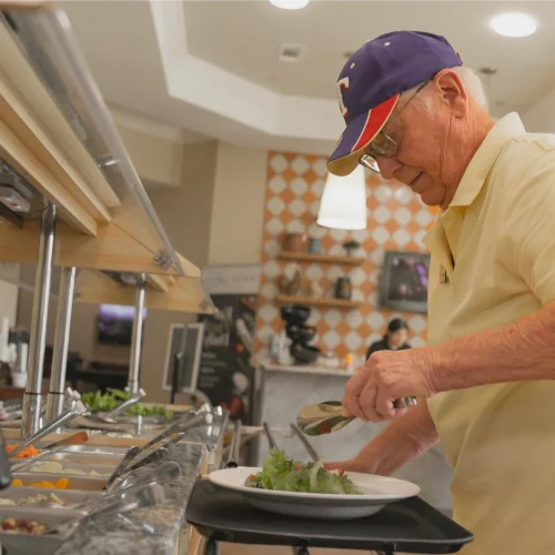 civitas-senior-living-resident-making-salad.webp