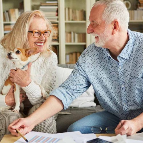 Civitas Senior Living | Happy senior couple discussing retirement savings