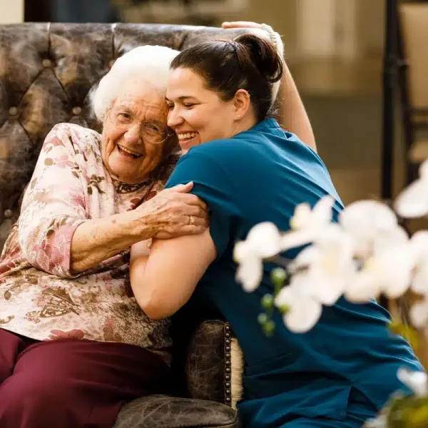 Senior Living Resident and Team Member Hugging