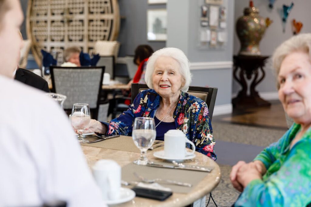 Civitas Senior Living | Senior residents drinking water in a dining room