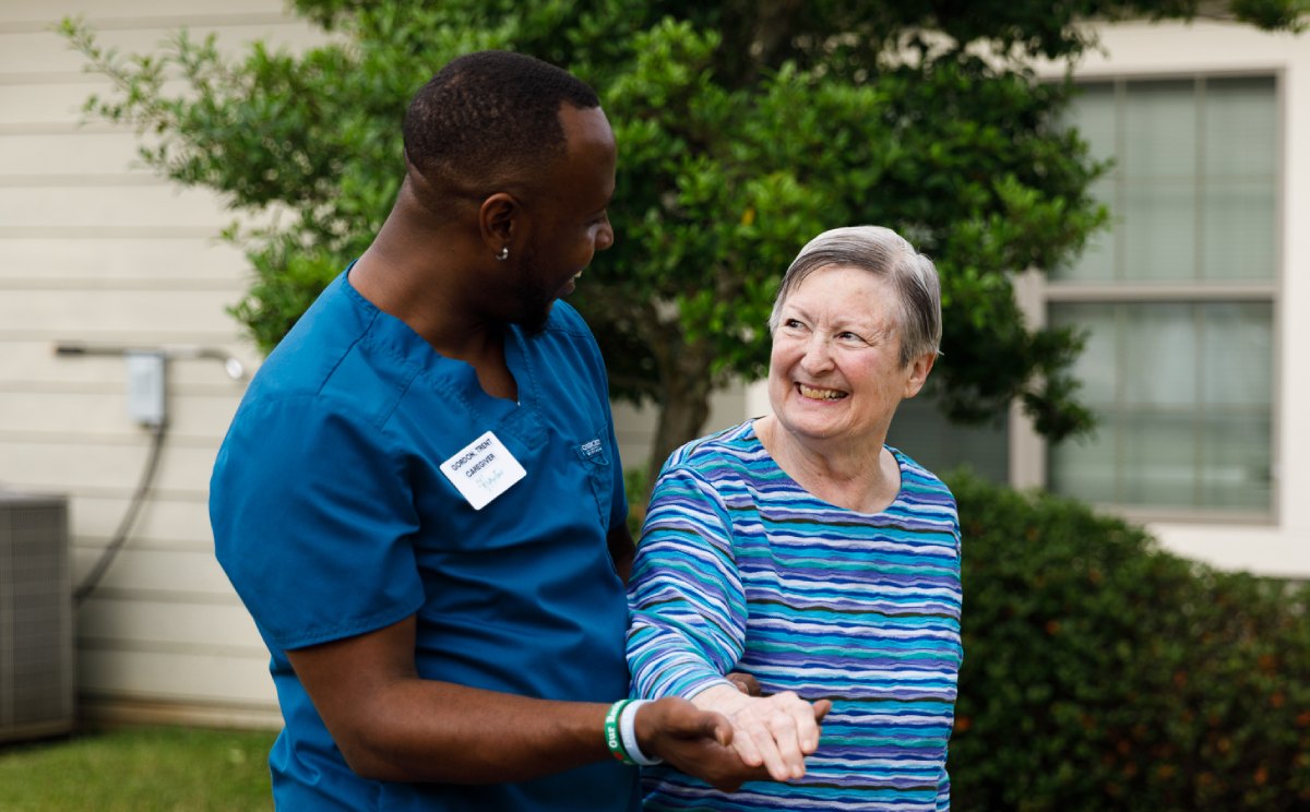 Civitas Senior Living | Senior woman walking with caregiver