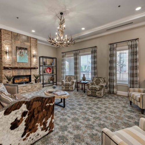 StoneCreek of Flying Horse | Living area with fireplace