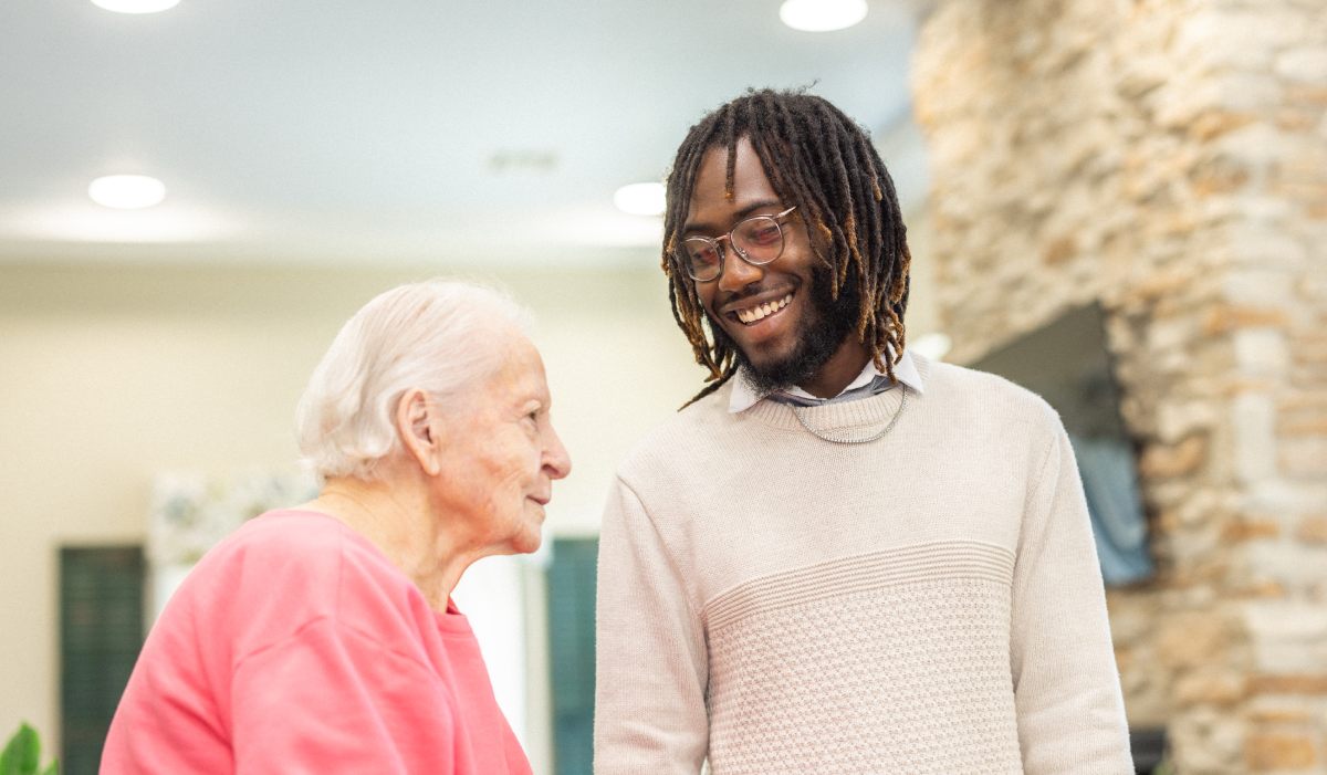 Civitas Senior Living | Caregiver talking with resident