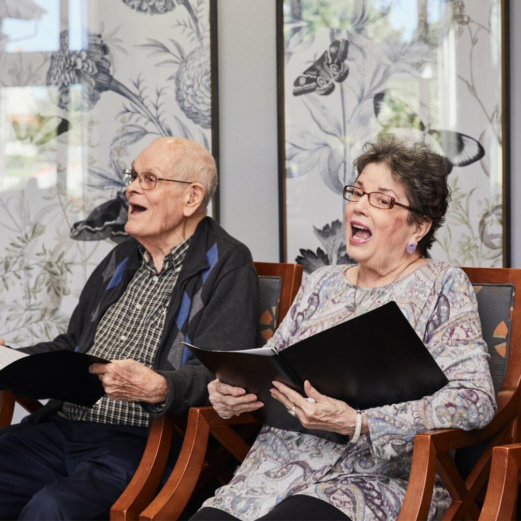 Senior couple signing in church