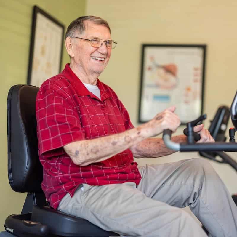 Civitas | Resident using exercise bike