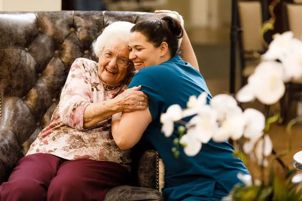 Senior Living Resident and Team Member Hugging