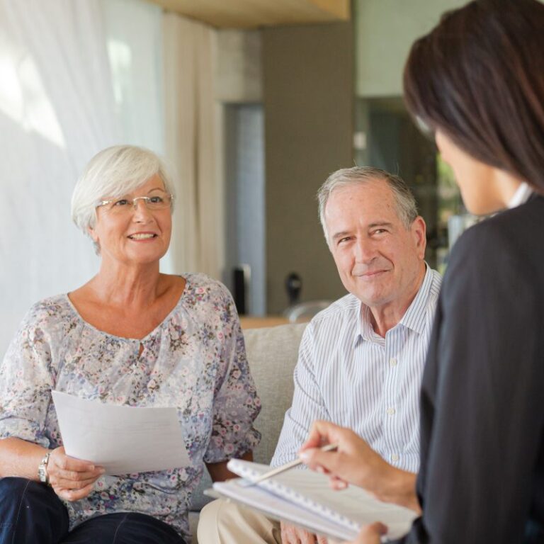senior couple seated in an estate planning consultation
