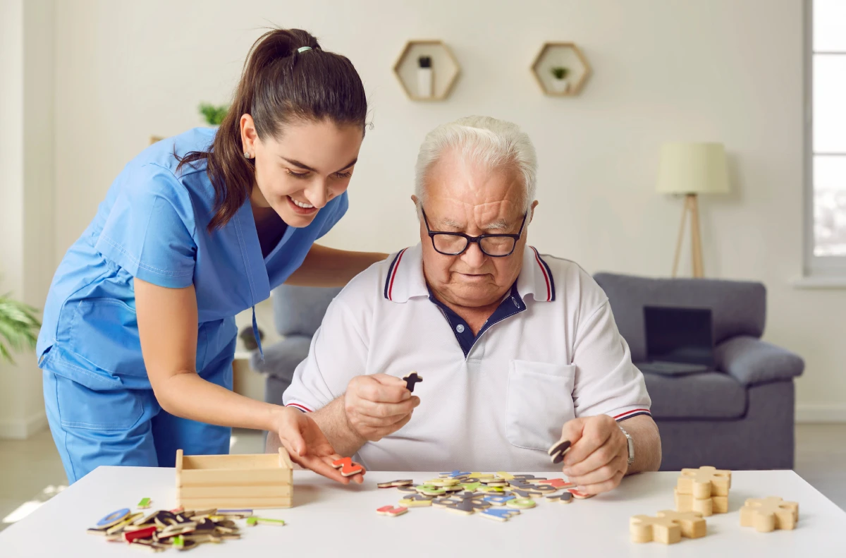 Civitas | Team member assisting memory care resident