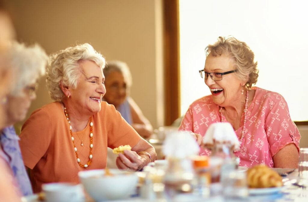 Civitas Senior Living | Seniors laughing at lunch