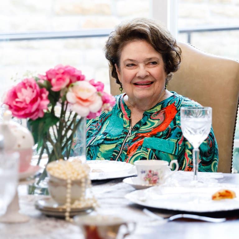 Civitas Senior Living | Senior woman at table for Passion Program