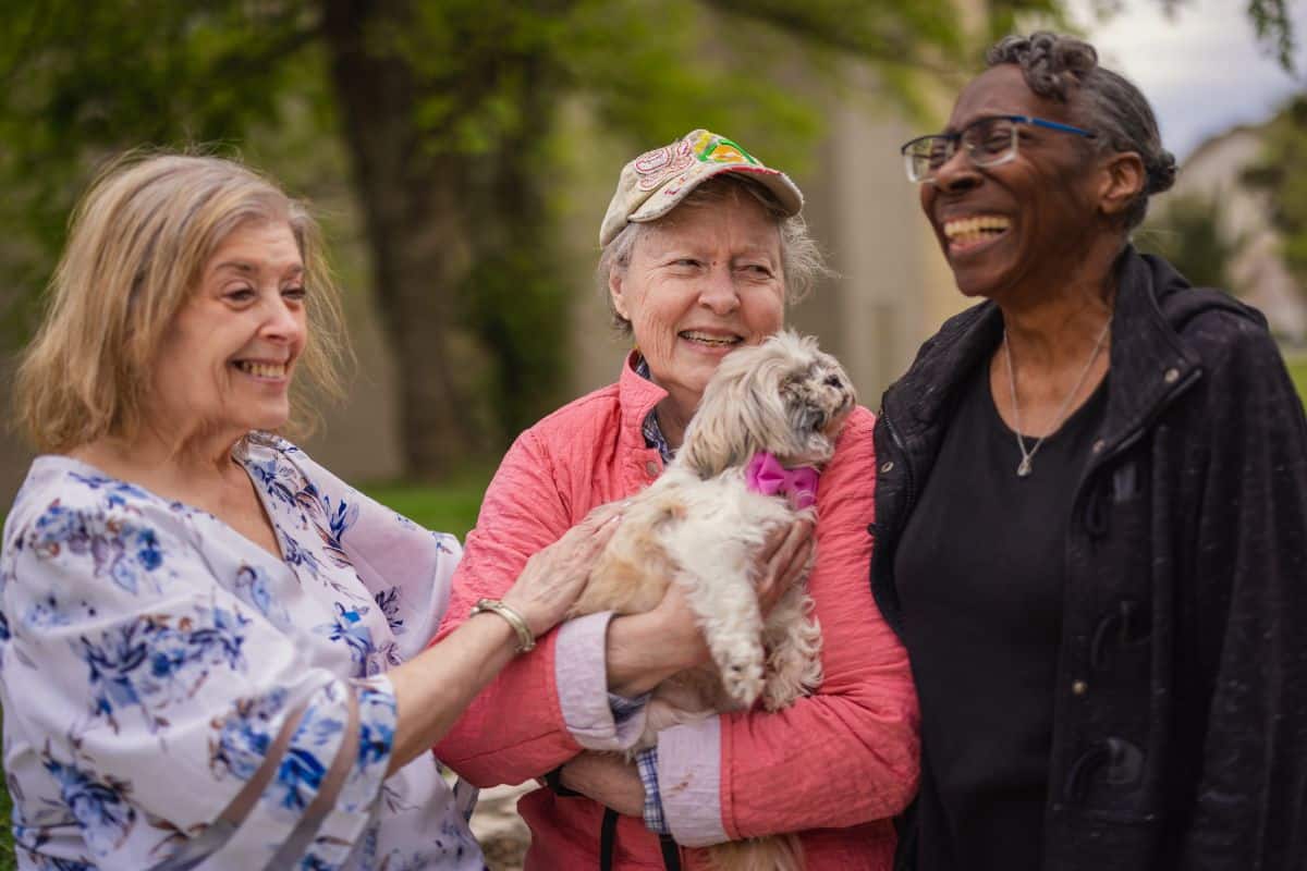 Civitas Senior Living | Seniors on a walk with a dog