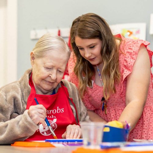 Civitas Senior Living | Senior resident crafting with caregiver