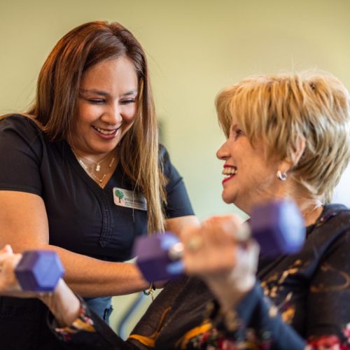Civitas | Caregiver helping resident with physical therapy